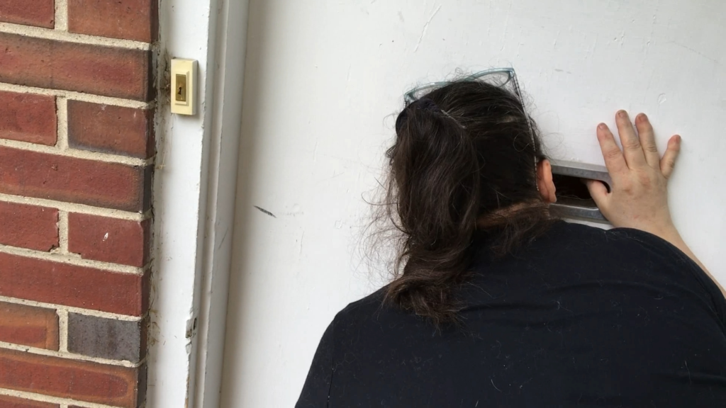sister at the mail slot