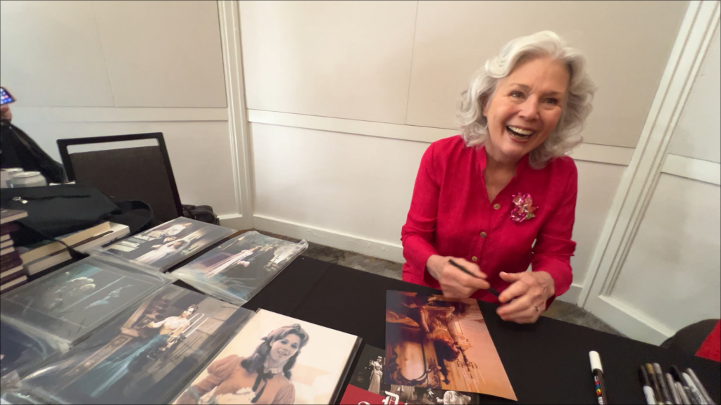 Kathryn Leigh Scott signing her autograph